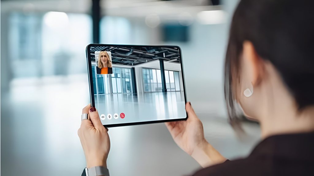 Professional using WhatsApp on iPad during a business meeting or online presentation